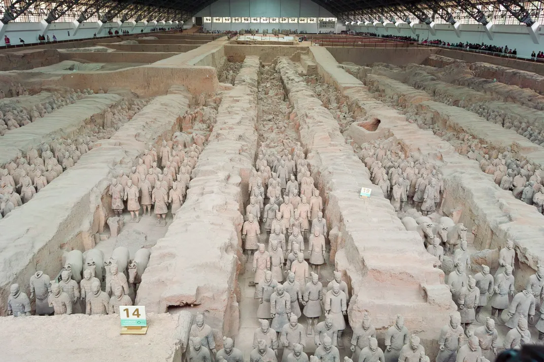 An aerial view of a pit filled with terra-cotta soldiers