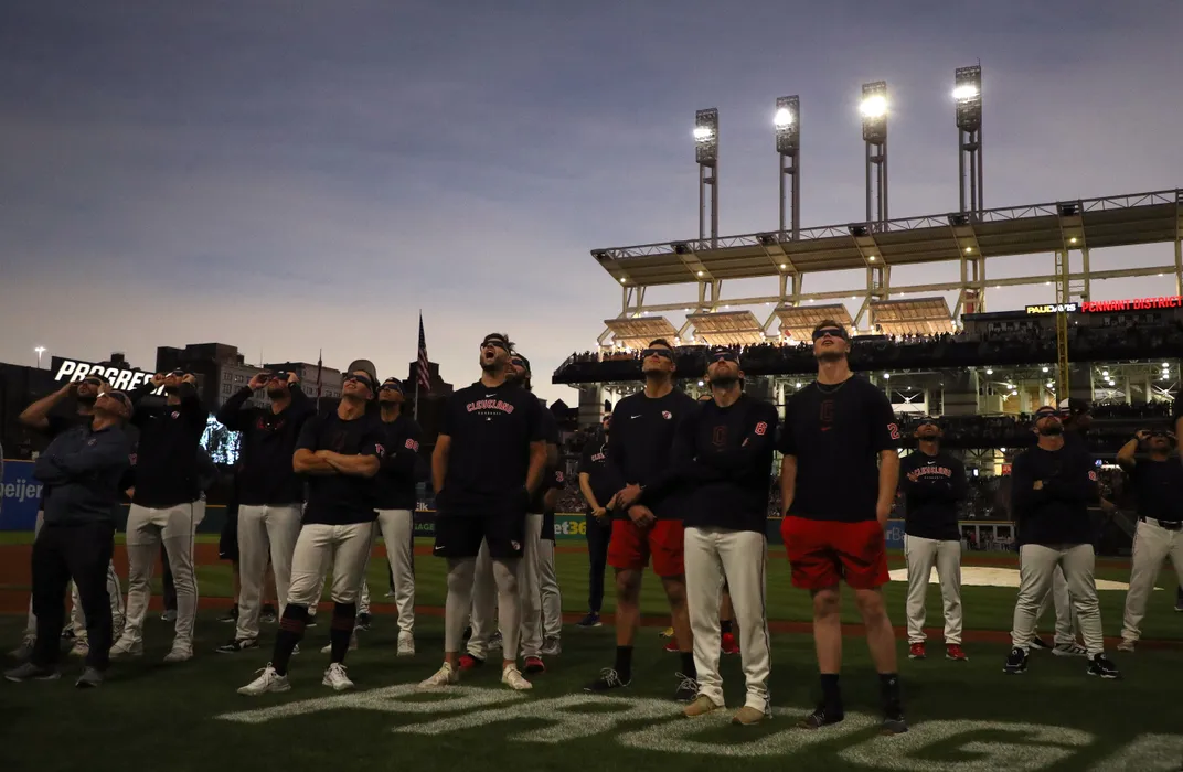 Baseball team watches the solar eclipse